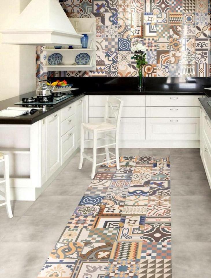 The Traditional Style White Kitchen Consists of Cabinets with S.S. Handles and Black Countertop