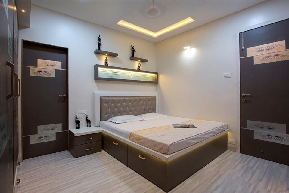 This Bedroom has a Rectangular Wooden Bed