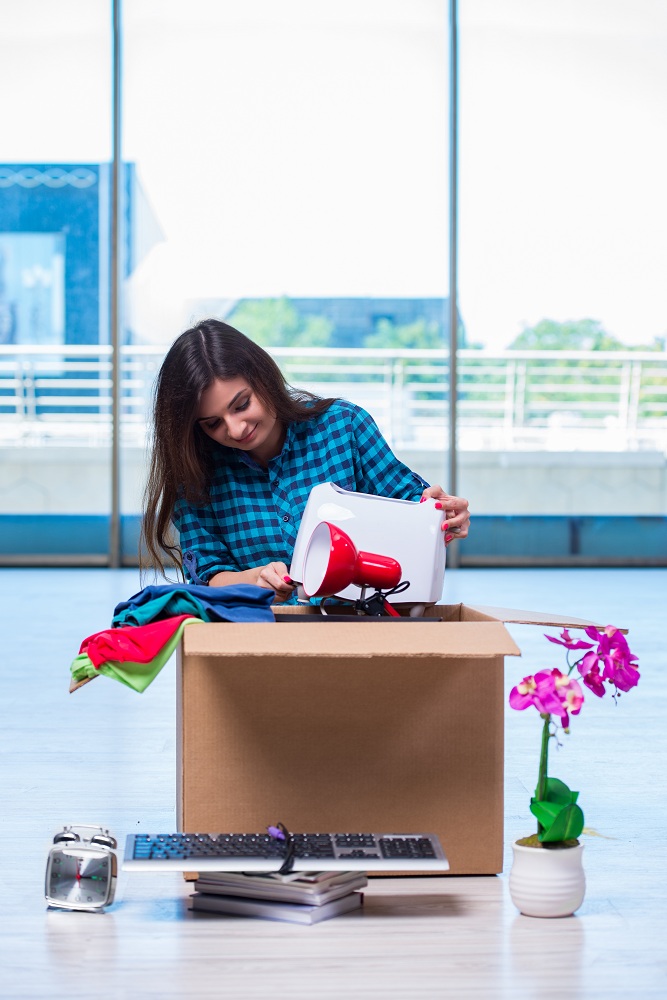 Women decluttering for house revamp Women decluttering for house revamp