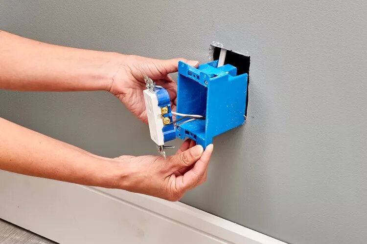 Remove the out-of-service outlet box