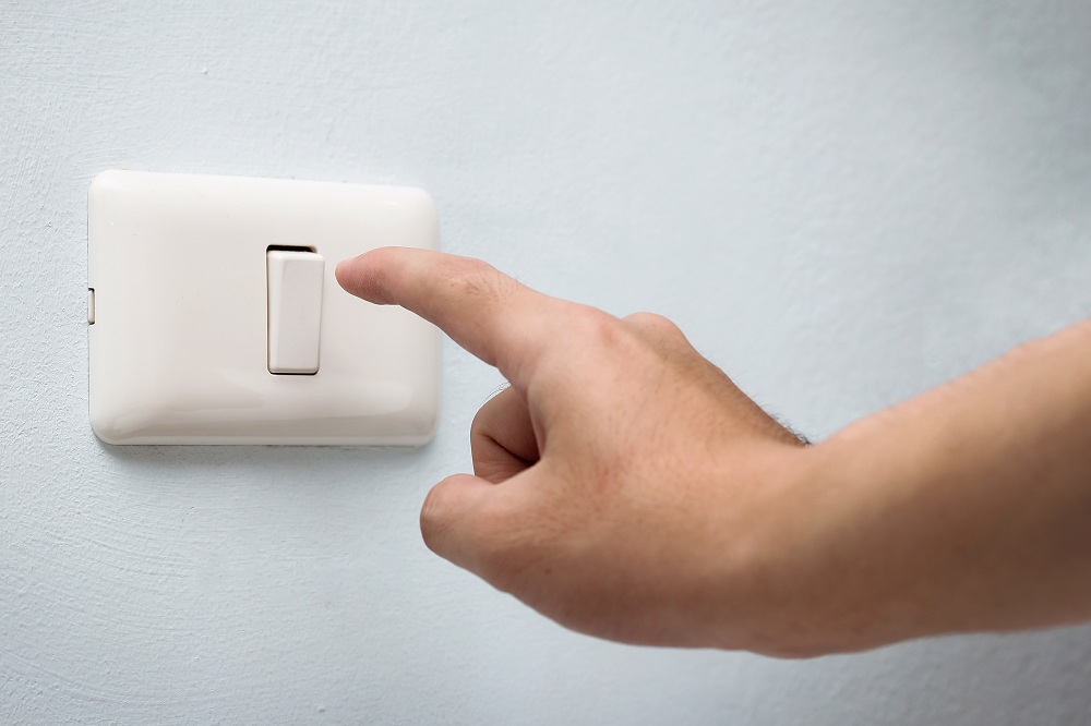 Switch on the sconce light