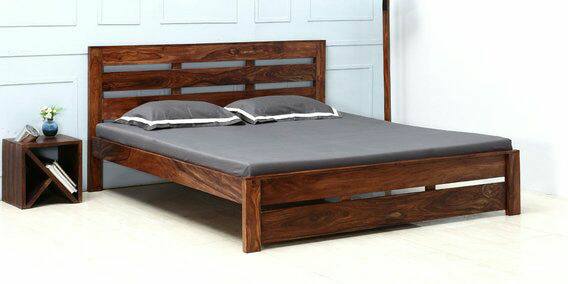 The Contemporary Wooden Rectangular Bed with Zebra Backrest is Looking Stylist with Grey Bedsheet & Cushions