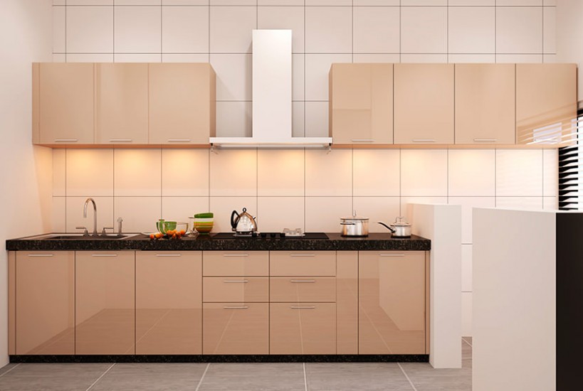 The Kitchen having Black Granite Linear Countertop with Built-In Gas Stove, Chimney & Single Bowl S.S. Sink is Looking Classy with Peach Colour Cabinets