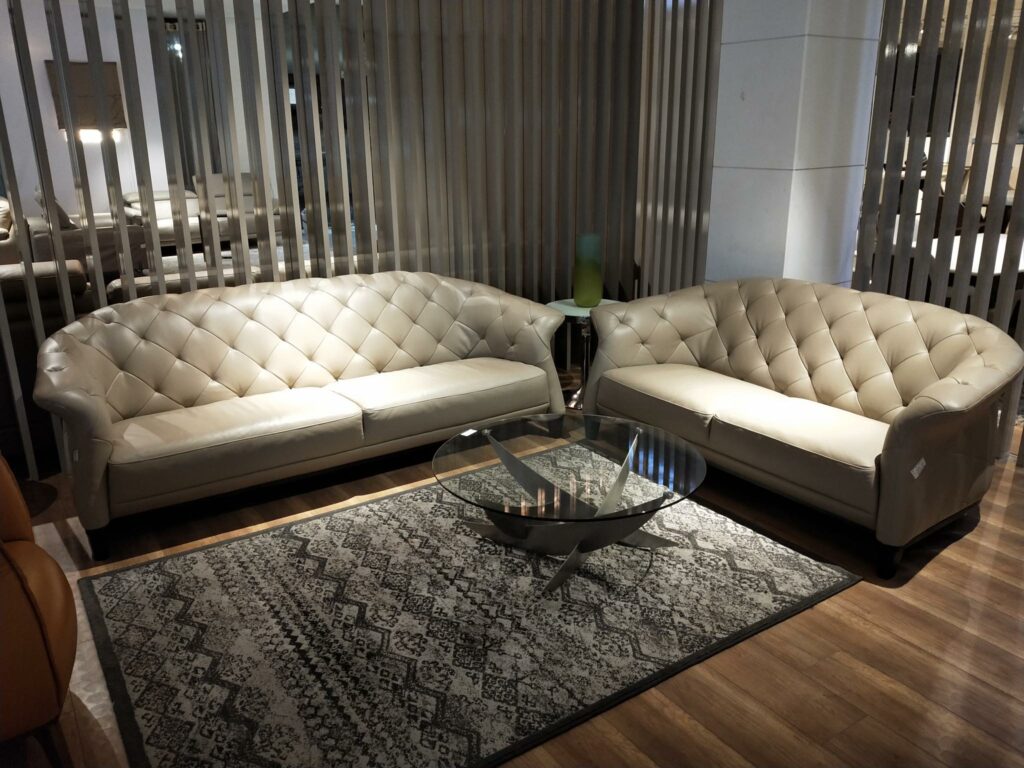 Off White Coloured Leather Upholstered Chesterfield Sofa