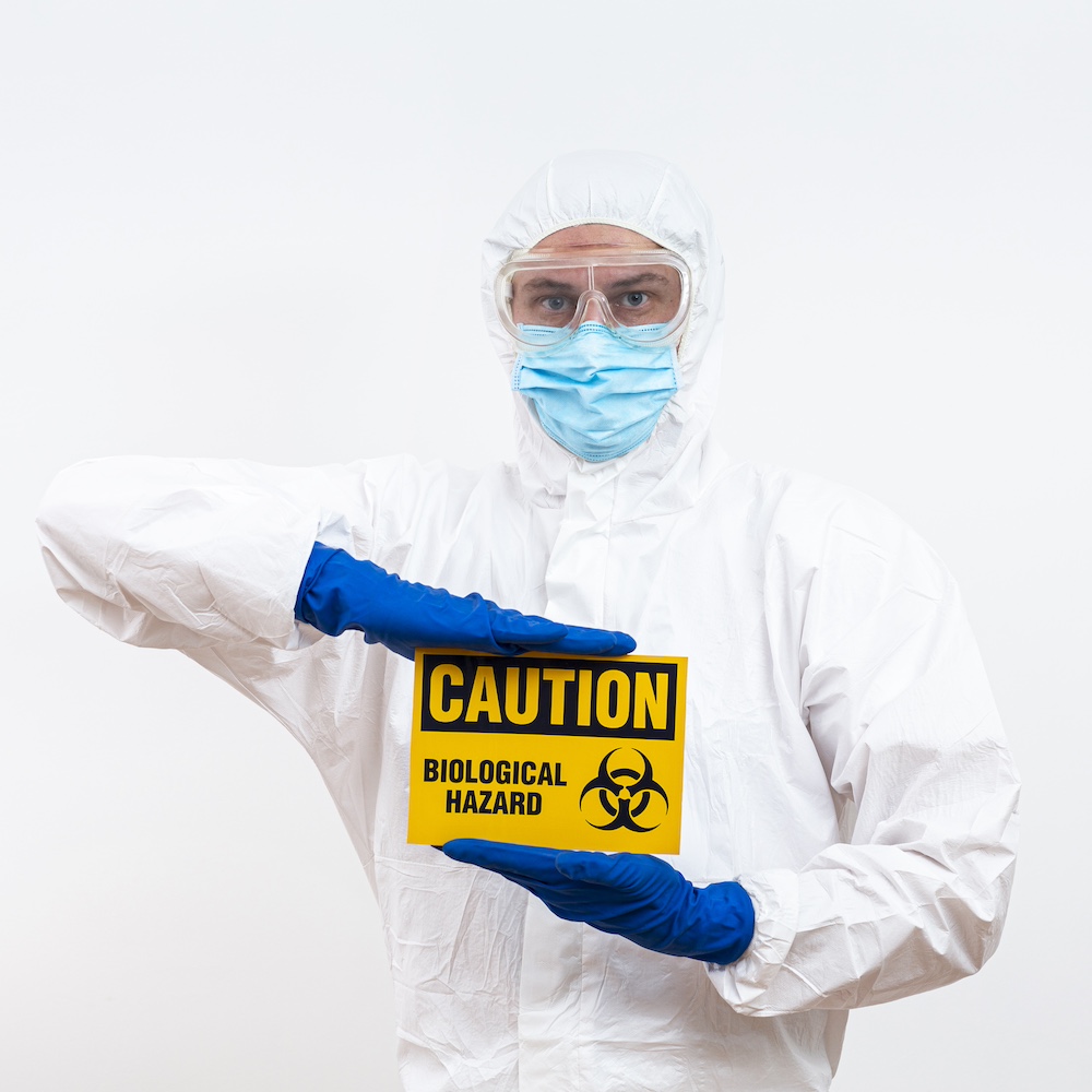 Professional Biohazard Cleanup Team Wearing PPE Kit