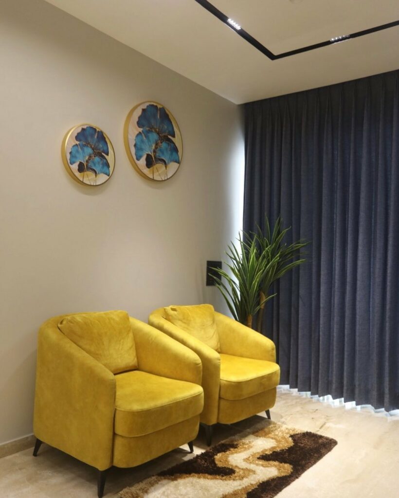 Two Yellow Upholstered Chairs