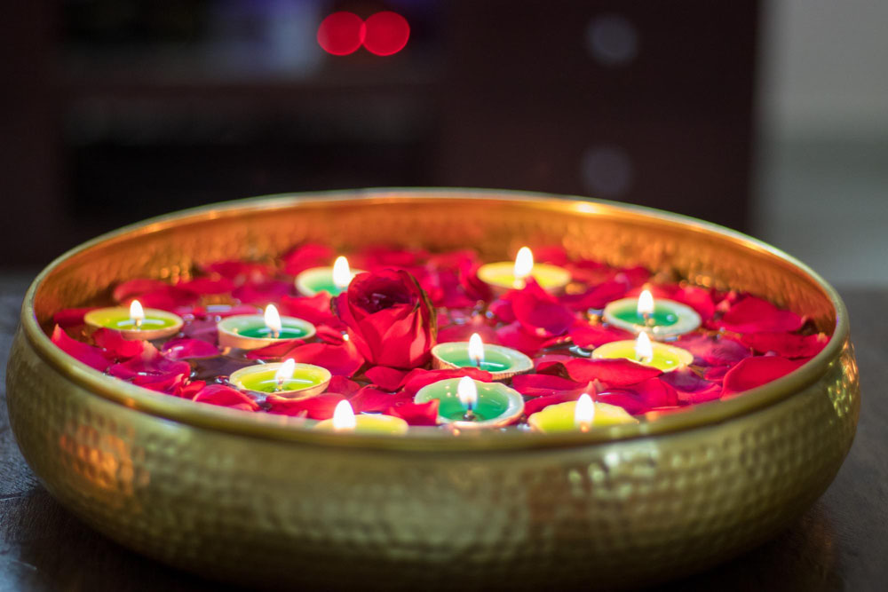Floating Diyas in Bowl of water & rose petals