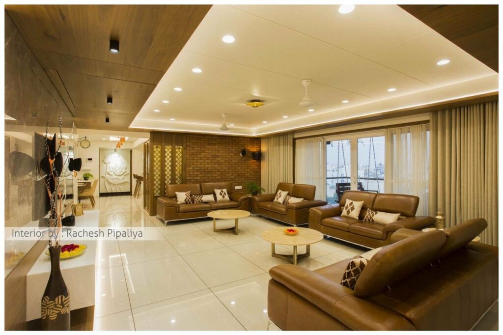 Spacious Living Room with High Ceilings and Predominantly White Decor