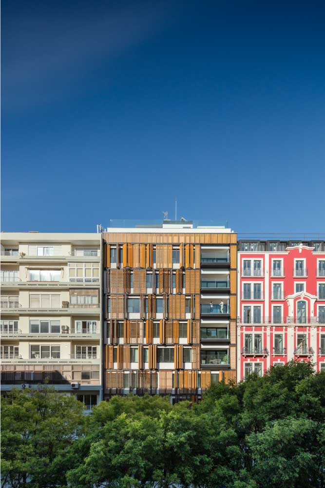 Lisbon Wood Building with Active Wooden Louvers