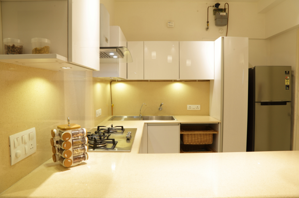 Handleless White Cabinetry with a Glossy Finish