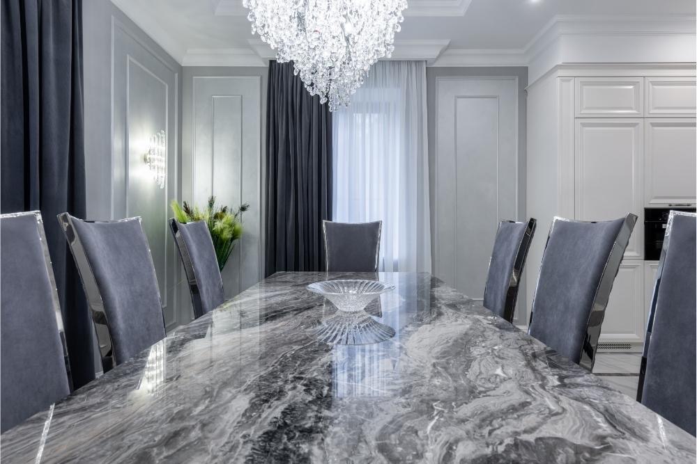 Chandelier Above Marble Dining Room Table