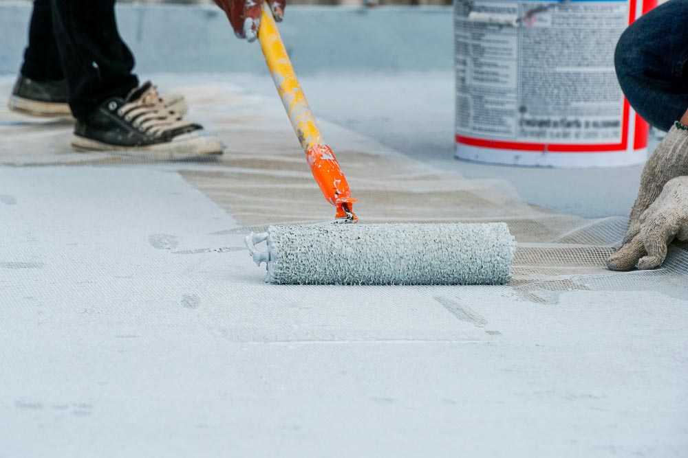 Worker Applying Waterproof Coating