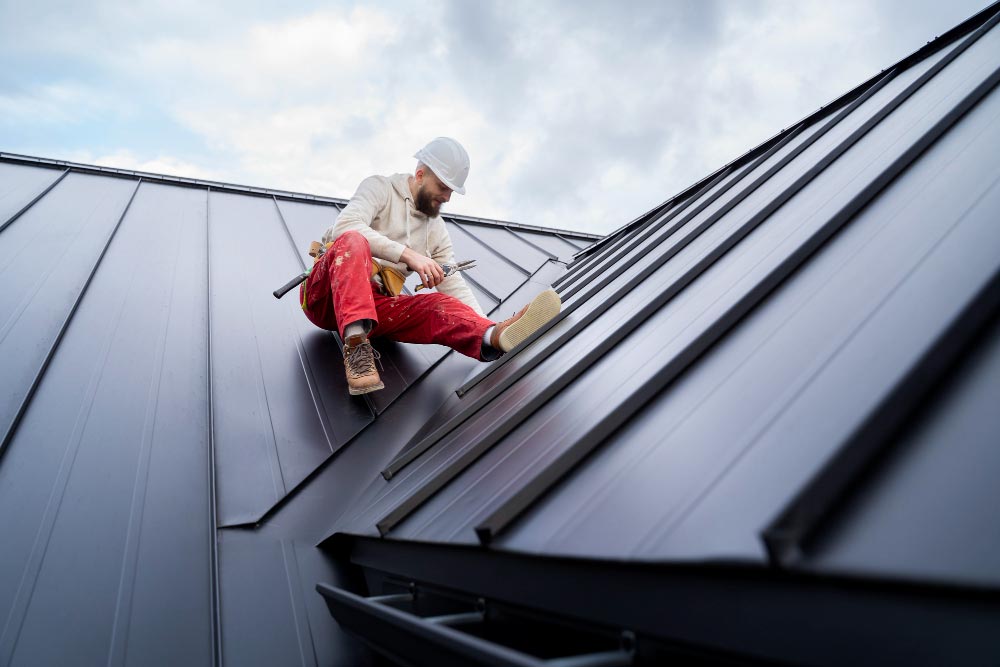 Worker Repairing Roof Surface