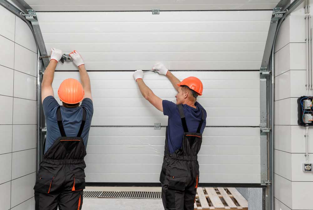 Professionals Repairing Door Tracks