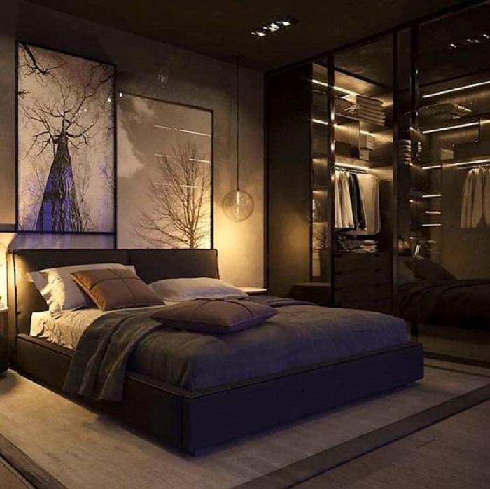 Luxury bedroom design with deep rich tones and soft golden lighting
