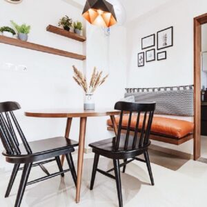 Modern dining area with wooden table and black chairs
