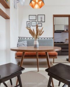 Modern dining area with wooden table and black chairs