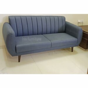 Modern two-seater sofa with soft blue upholstery and tapered wooden legs