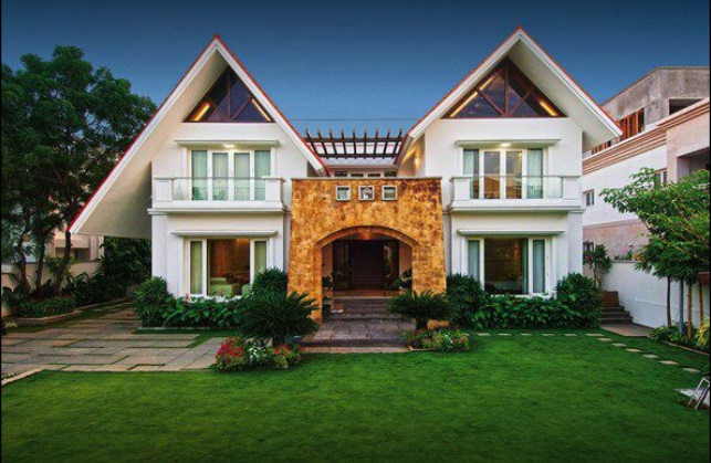 Modern duplex house with unique triangular roof design